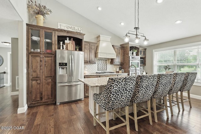 7870 County Lane 287, Carl Junction, MO 64834 - kitchen featuring appliances with stainless steel finishes, open shelves, custom range hood, a breakfast bar, and recessed lighting