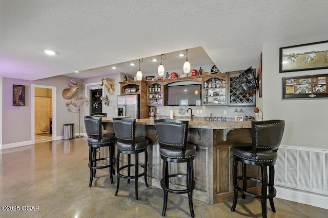 7870 County Lane 287, Carl Junction, MO 64834 - indoor wet bar with stainless steel refrigerator with ice dispenser, recessed lighting, baseboards, a textured ceiling, and hanging light fixtures