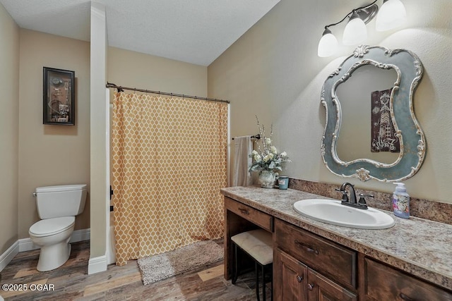 7870 County Lane 287, Carl Junction, MO 64834 - bathroom with vanity, wood finished floors, toilet, and curtained shower