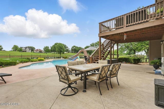 7870 County Lane 287, Carl Junction, MO 64834 - view of pool with a water slide, stairs, a patio, a deck, and outdoor dining area