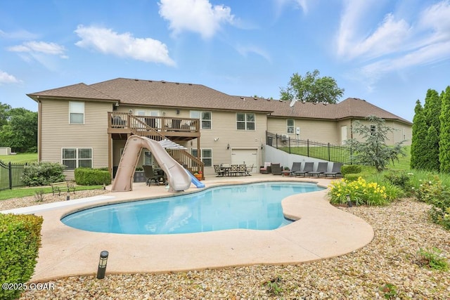 7870 County Lane 287, Carl Junction, MO 64834 - view of pool featuring a water slide, stairs, a patio area, and a wooden deck