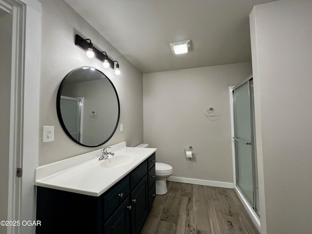 204 Webb St, Duenweg, MO 64841 - bathroom with wood finished floors, vanity, toilet, and a shower with door