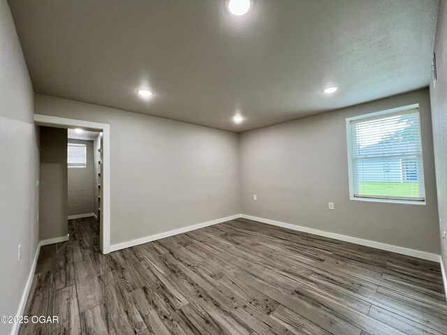 204 Webb St, Duenweg, MO 64841 - empty room featuring wood finished floors, baseboards, and recessed lighting