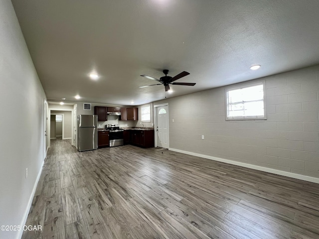204 Webb St, Duenweg, MO 64841 - unfurnished living room with dark wood-style flooring, baseboards, a ceiling fan, and recessed lighting