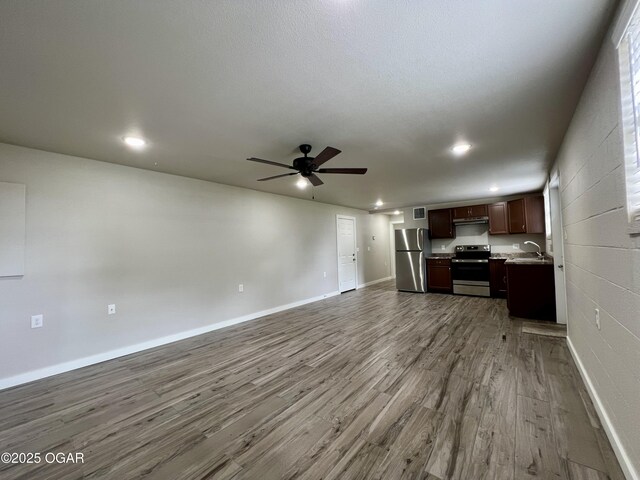204 Webb St, Duenweg, MO 64841 - unfurnished living room featuring a sink, ceiling fan, wood finished floors, recessed lighting, and baseboards