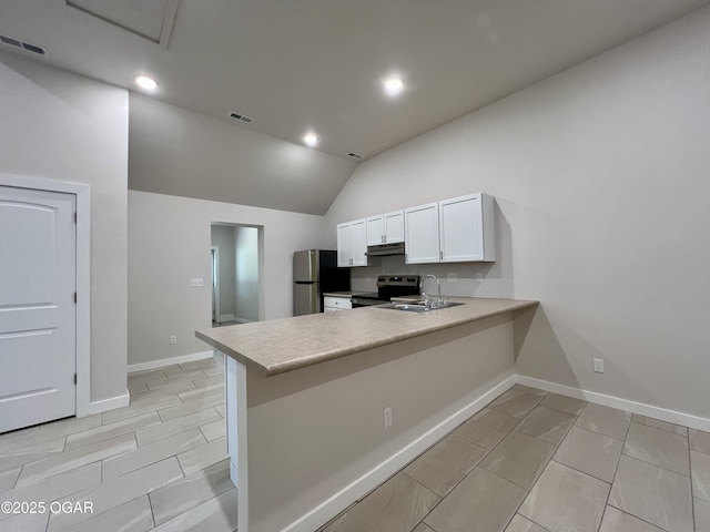 204 Webb St, Duenweg, MO 64841 - kitchen with stainless steel appliances, lofted ceiling, under cabinet range hood, a peninsula, and white cabinets