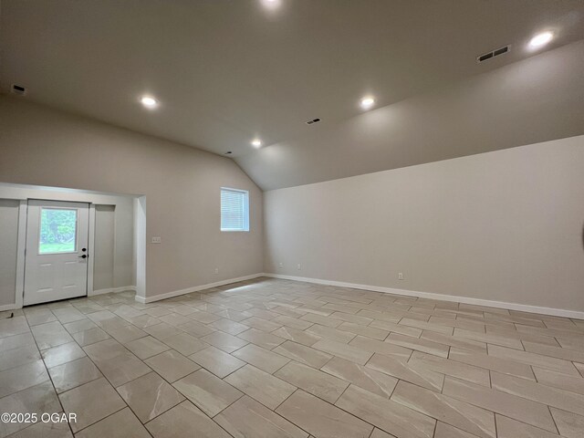204 Webb St, Duenweg, MO 64841 - unfurnished room featuring lofted ceiling, plenty of natural light, recessed lighting, baseboards, and light tile patterned floors
