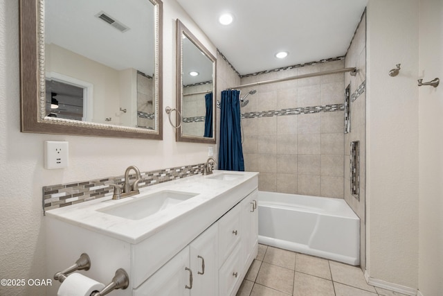 13072 Cody Ln, Diamond, MO 64840 - full bathroom with shower / bath combo, double vanity, tile patterned flooring, recessed lighting, and decorative backsplash