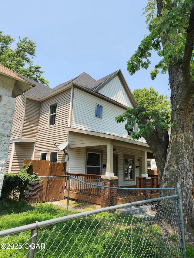 210 S Pearl Ave, Joplin, MO 64801 - view of front facade with a porch
