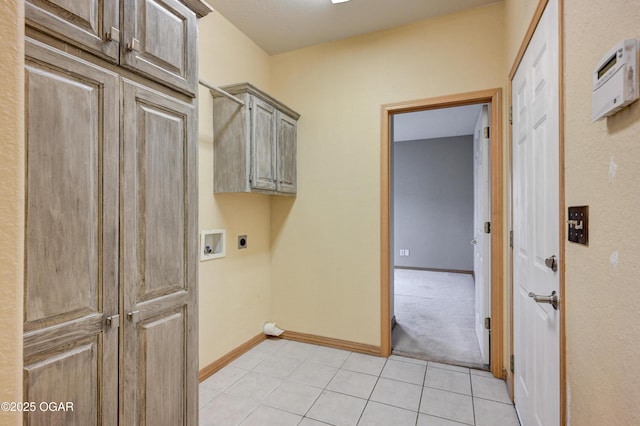 4320 Wisteria Way, Joplin, MO 64801 - washroom featuring electric dryer hookup, cabinet space, light tile patterned flooring, hookup for a washing machine, and baseboards