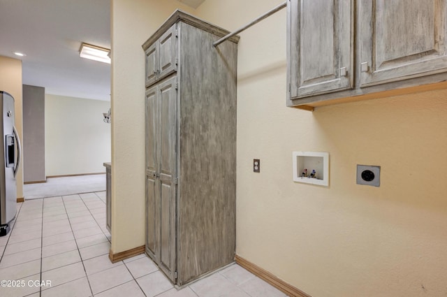 4320 Wisteria Way, Joplin, MO 64801 - laundry area with hookup for an electric dryer, cabinet space, hookup for a washing machine, baseboards, and light tile patterned flooring