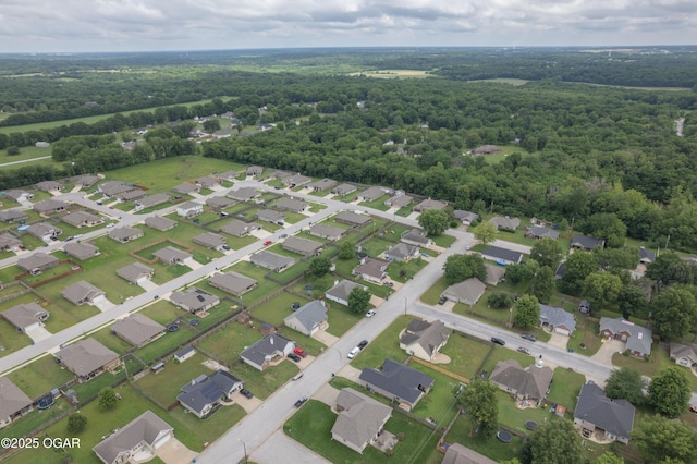 330 Sadie Ln, Webb City, MO 64870 - aerial view of property's location with nearby suburban area and a heavily wooded area