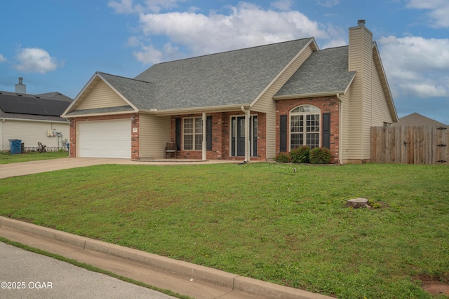 330 Sadie Ln, Webb City, MO 64870 - view of front of house with brick siding, an attached garage, driveway, and a shingled roof