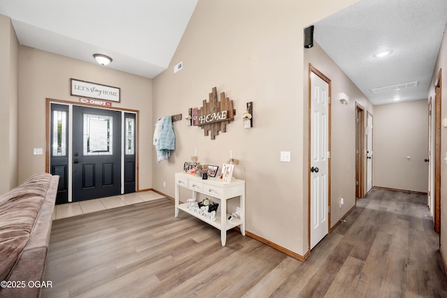 330 Sadie Ln, Webb City, MO 64870 - entryway with light wood-style floors, baseboards, and lofted ceiling