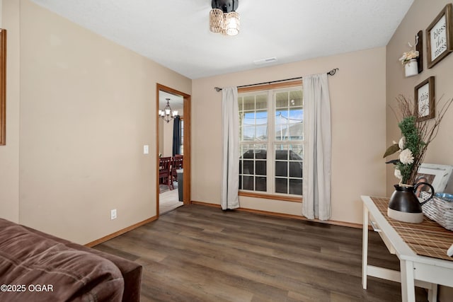 330 Sadie Ln, Webb City, MO 64870 - living area featuring a chandelier, wood finished floors, and baseboards