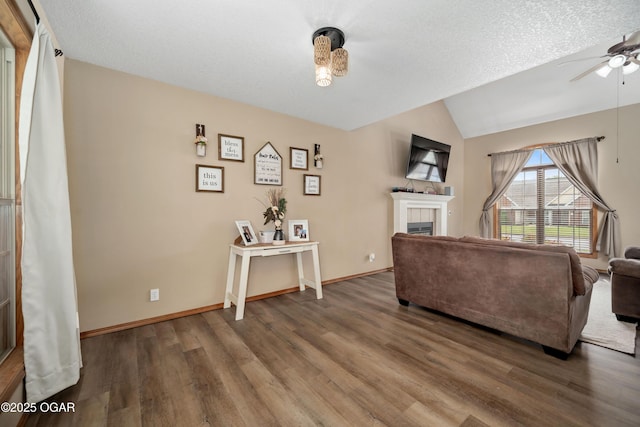 330 Sadie Ln, Webb City, MO 64870 - living room featuring a ceiling fan, wood finished floors, lofted ceiling, a fireplace, and baseboards