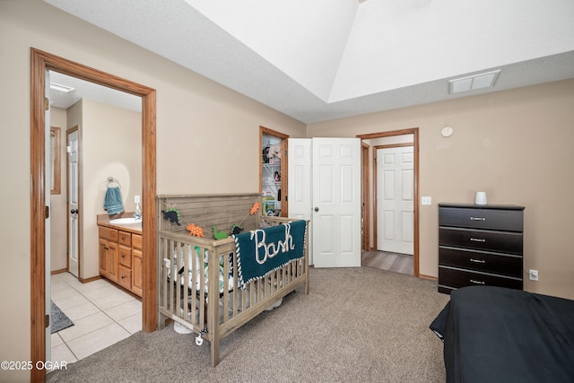 330 Sadie Ln, Webb City, MO 64870 - bedroom with a sink, light colored carpet, light tile patterned floors, and ensuite bath