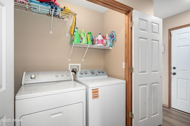 330 Sadie Ln, Webb City, MO 64870 - laundry room featuring washer and dryer and wood finished floors