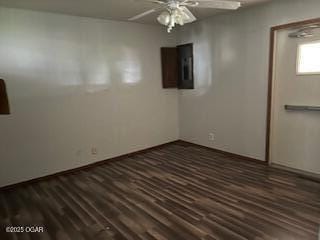 105 N Pearl Ave, Joplin, MO 64801 - empty room with a ceiling fan, dark wood-style flooring, and baseboards