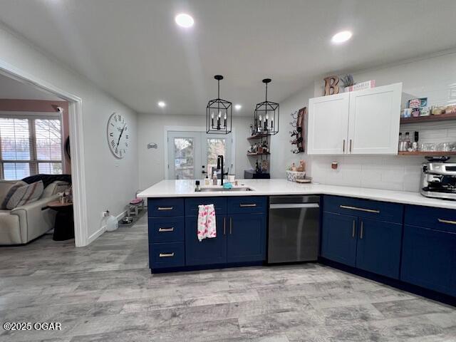 3331 Willow Ln, Joplin, MO 64801 - kitchen featuring dishwashing machine, blue cabinets, a sink, a peninsula, and recessed lighting
