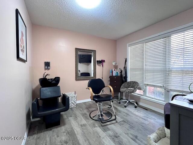 3331 Willow Ln, Joplin, MO 64801 - office area with a textured ceiling, baseboards, and wood finished floors