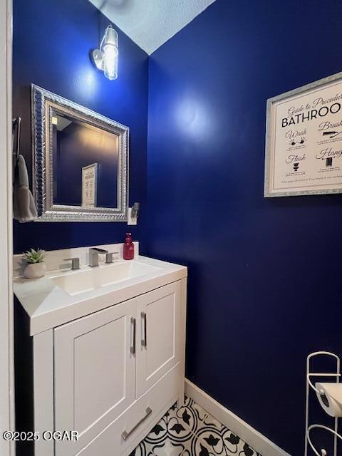 3331 Willow Ln, Joplin, MO 64801 - bathroom featuring vanity, baseboards, and tile patterned floors