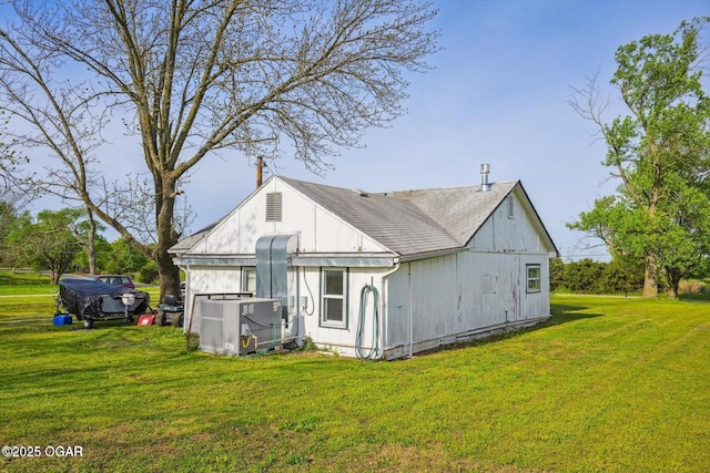 615 N Van Hoorebeke Rd, Joplin, MO 64801 - back of property featuring a lawn and central AC unit
