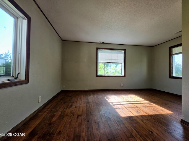 615 N Van Hoorebeke Rd, Joplin, MO 64801 - unfurnished room featuring a textured ceiling, hardwood / wood-style floors, and baseboards