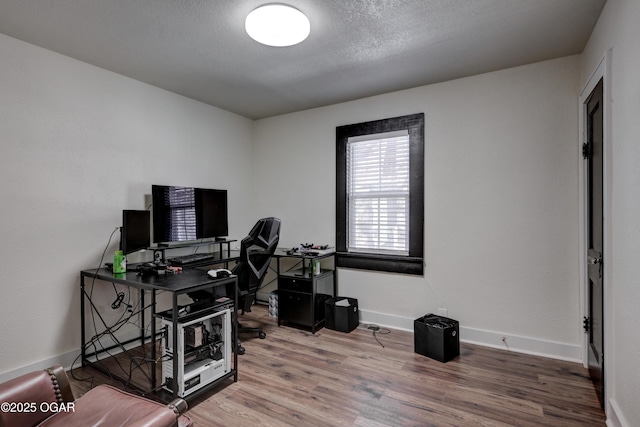 118 N Byers Ave, Joplin, MO 64801 - home office with wood finished floors, baseboards, and a textured ceiling