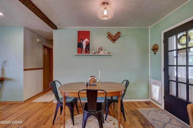 509 Brentwood Dr, Carl Junction, MO 64834 - dining area featuring a textured ceiling, wood finished floors, and beam ceiling