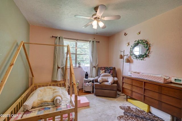 509 Brentwood Dr, Carl Junction, MO 64834 - bedroom with a textured ceiling and a ceiling fan