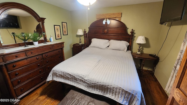 3002 S Main St, Galena, KS 66739 - bedroom with dark wood-style floors