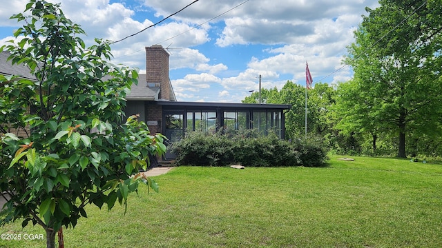 3002 S Main St, Galena, KS 66739 - view of grassy yard featuring a sunroom