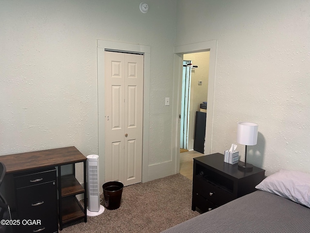 507 W Hill St, Neosho, MO 64850 - carpeted bedroom featuring a closet and a textured wall