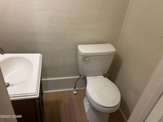 507 W Hill St, Neosho, MO 64850 - half bath featuring vanity and wood finished floors