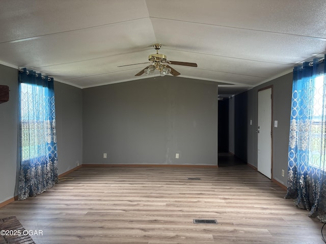 1346 SE Gum Ln, Baxter Springs, KS 66713 - spare room featuring light wood finished floors, ceiling fan, and lofted ceiling