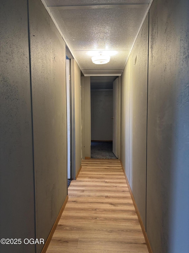 1346 SE Gum Ln, Baxter Springs, KS 66713 - hall featuring light wood-style floors and a textured ceiling