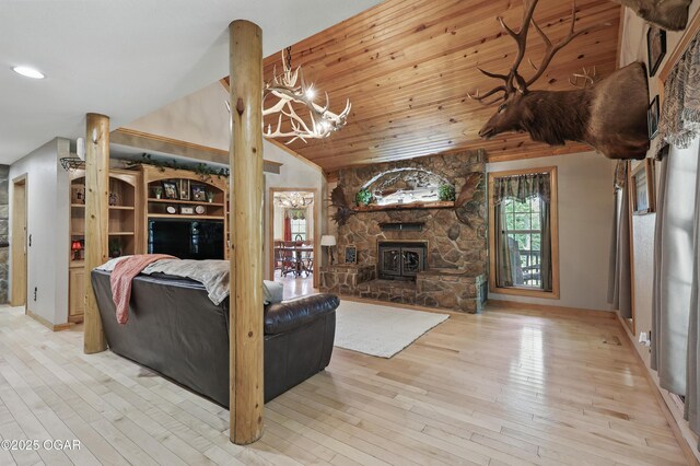 9404 County Lane 121, Carthage, MO 64836 - living area with wood finished floors, a chandelier, and lofted ceiling