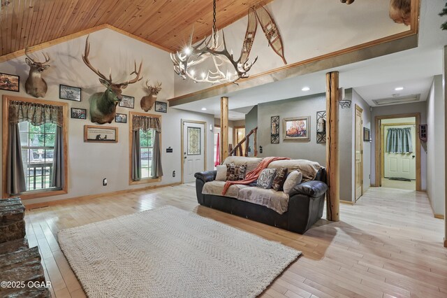 9404 County Lane 121, Carthage, MO 64836 - living room with wood ceiling, healthy amount of natural light, light wood-type flooring, high vaulted ceiling, and a chandelier