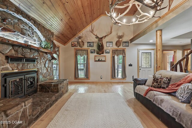 9404 County Lane 121, Carthage, MO 64836 - living room with wood ceiling, healthy amount of natural light, wood-type flooring, high vaulted ceiling, and a fireplace
