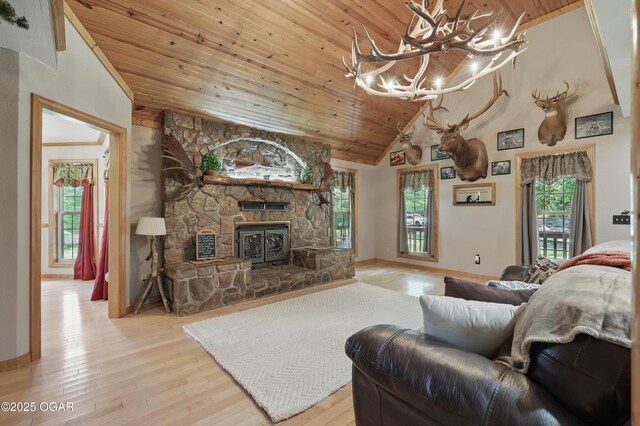 9404 County Lane 121, Carthage, MO 64836 - living area featuring wooden ceiling, wood-type flooring, healthy amount of natural light, a chandelier, and a fireplace