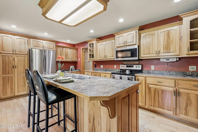 9404 County Lane 121, Carthage, MO 64836 - kitchen featuring stainless steel appliances, light brown cabinets, a kitchen bar, an island with sink, and recessed lighting