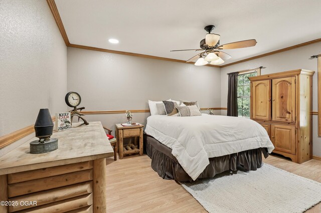 9404 County Lane 121, Carthage, MO 64836 - bedroom with ornamental molding, light wood-style flooring, and a ceiling fan