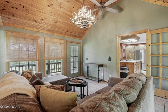 9404 County Lane 121, Carthage, MO 64836 - living area featuring light tile patterned floors, wooden ceiling, a chandelier, ceiling fan, and high vaulted ceiling