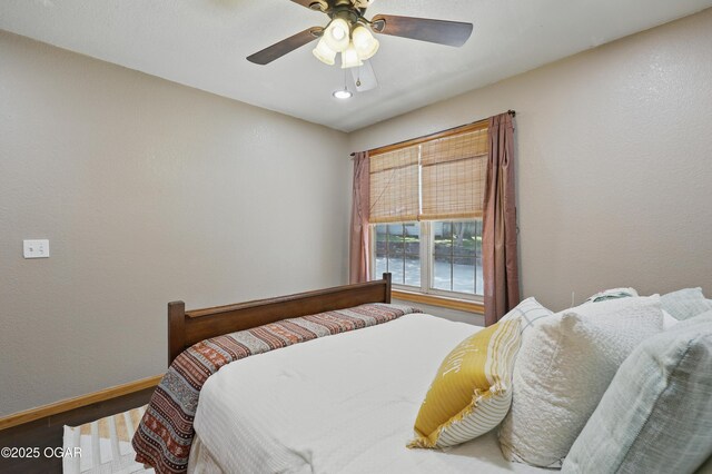 9404 County Lane 121, Carthage, MO 64836 - bedroom featuring wood finished floors and a ceiling fan