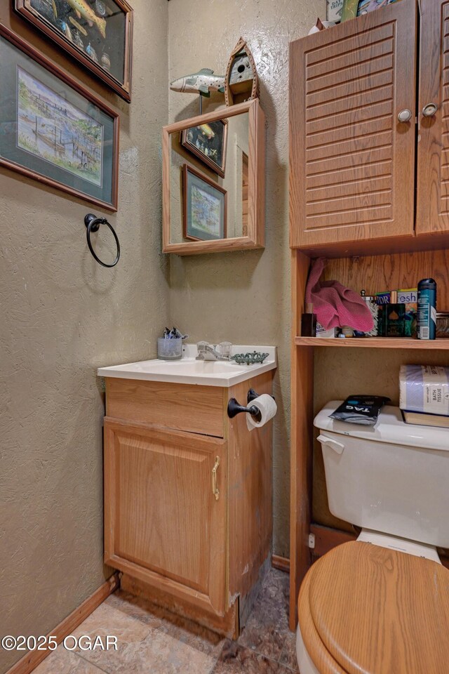 9404 County Lane 121, Carthage, MO 64836 - bathroom featuring vanity and a textured wall