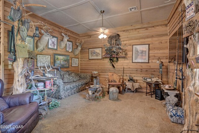 9404 County Lane 121, Carthage, MO 64836 - living room featuring carpet floors and wood walls