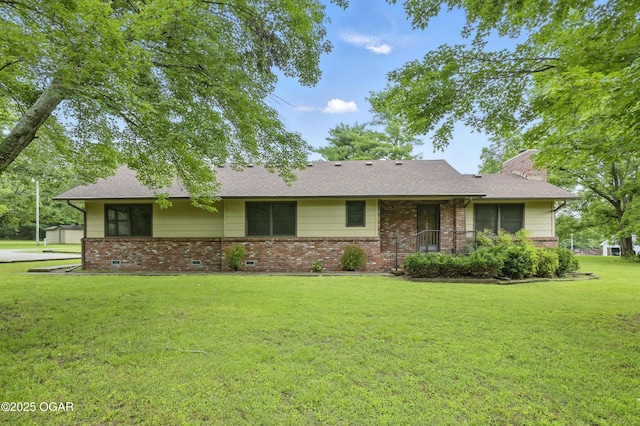 5694 Spurgeon Rd, Joplin, MO 64804 - single story home with brick siding, a front yard, a chimney, and a shingled roof