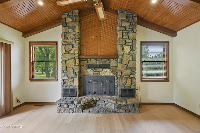5694 Spurgeon Rd, Joplin, MO 64804 - living area featuring lofted ceiling, a stone fireplace, wood ceiling, healthy amount of natural light, and wood finished floors