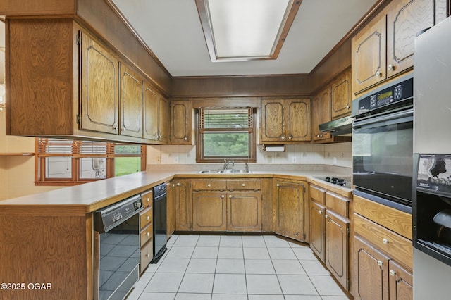 5694 Spurgeon Rd, Joplin, MO 64804 - kitchen featuring black appliances, light tile patterned floors, light countertops, and backsplash